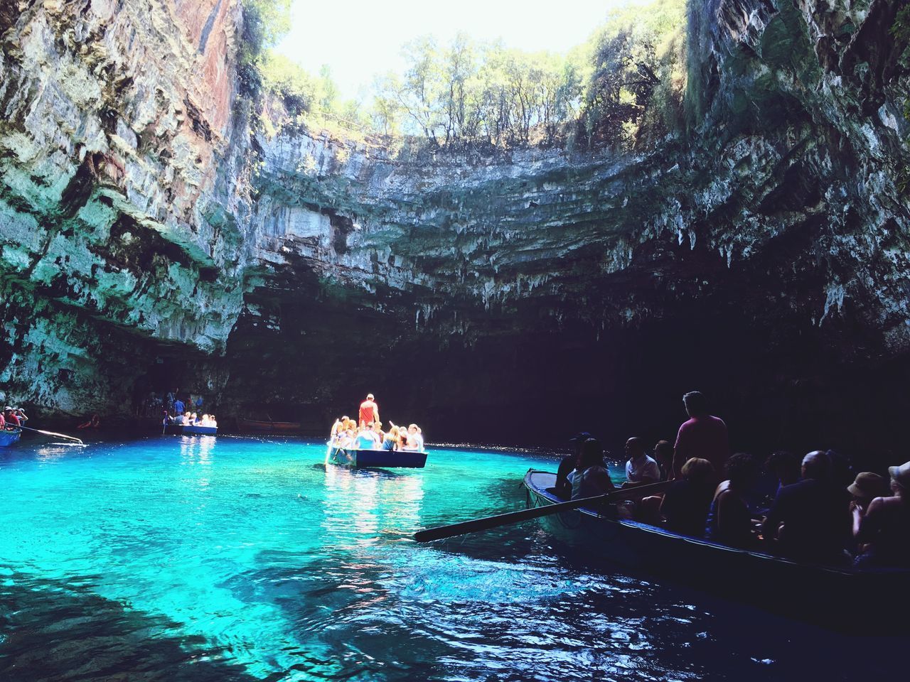 PEOPLE IN BOAT ON SHORE