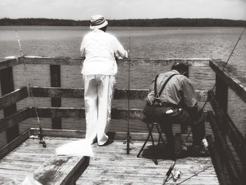 Woman standing on pier