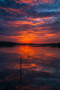 Scenic view of sea against romantic sky at sunset