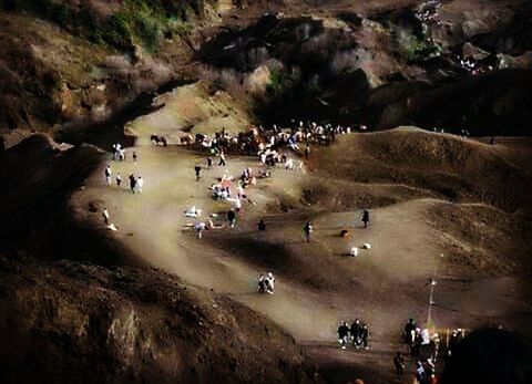 large group of people, high angle view, mountain, lifestyles, leisure activity, men, mixed age range, person, tourist, vacations, landscape, tourism, travel, travel destinations, medium group of people, nature, crowd, rock formation, unrecognizable person