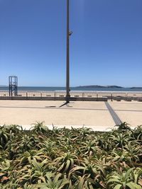 Scenic view of sea against clear blue sky