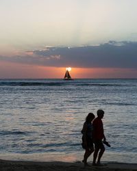 Scenic view of sea at sunset