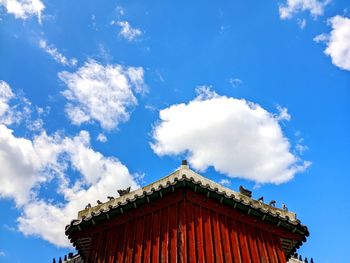 Low angle view of building against blue sky