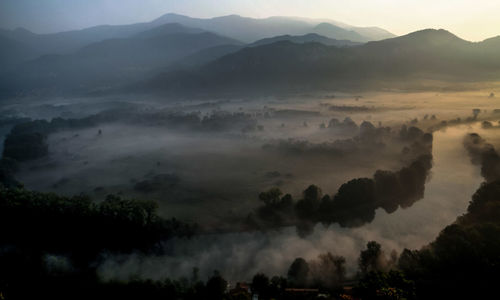 Scenic view of silhouette mountains against sky