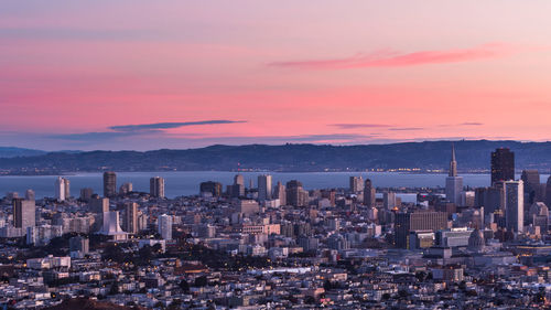 High angle view of buildings against sky during sunset