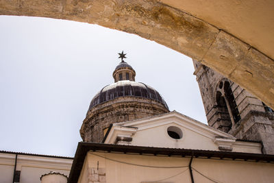 Low angle view of historic building against clear sky sulmona