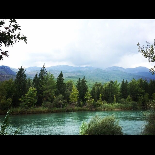 SCENIC VIEW OF LAKE IN MOUNTAINS