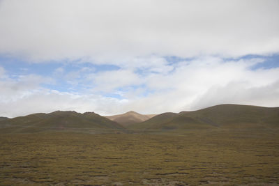 Scenic view of landscape and mountains against sky