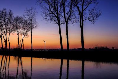 Scenic view of lake at sunset