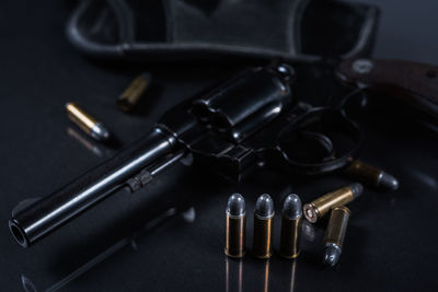 Close-up of handgun on table