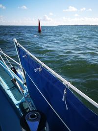 High angle view of sailboat sailing in sea against sky