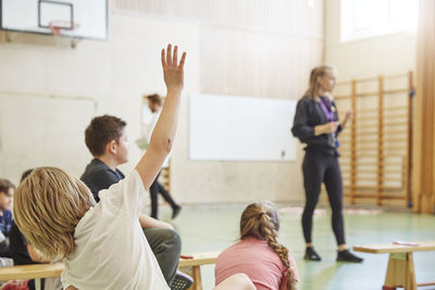 Children having class in school gym