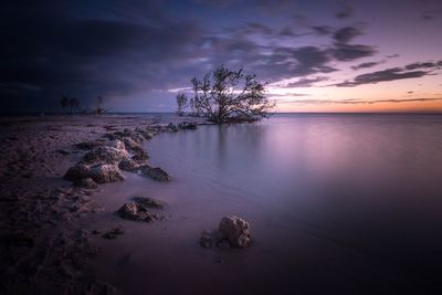 Scenic view of sea against sky at sunset