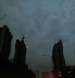 Silhouette statue of city at night