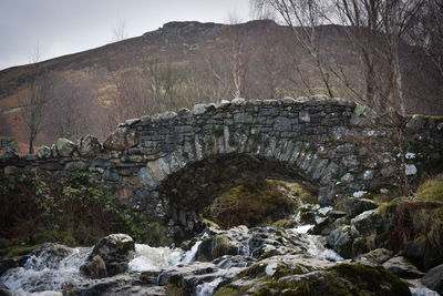 Arch bridge over mountains