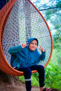 Full length portrait of girl standing in park