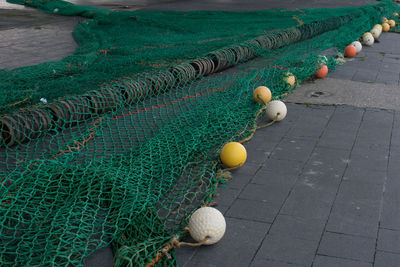 High angle view of fishing net on footpath