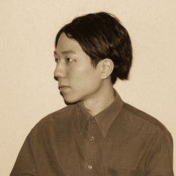 Portrait of young man against white background