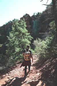Full length of man walking in forest