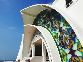 Low angle view of mosque against blue sky