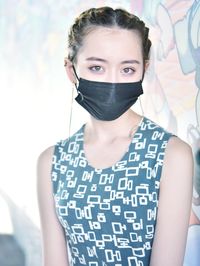 Portrait of a beautiful young woman covering face