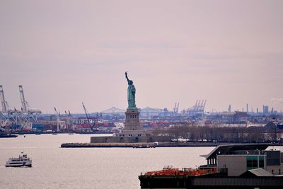 Scenic view of statue of liberty and construction work