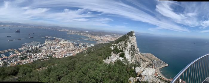 High angle view of buildings by sea against sky