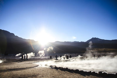 Geyser at el tatio against clear blue sky