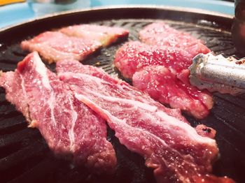 Close-up of meat on barbecue grill