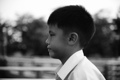 Portrait of boy looking away outdoors