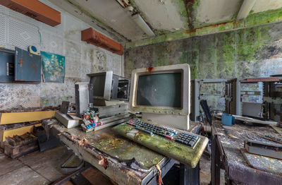 Old computers from the 80s in an abandoned computing center