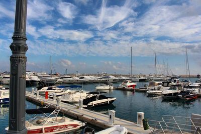 Boats moored at harbor