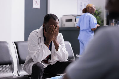 Doctor examining patient in clinic