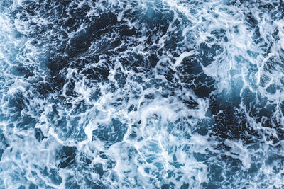 Top down view of whitewater leaving a pattern on the mediterranean sea.