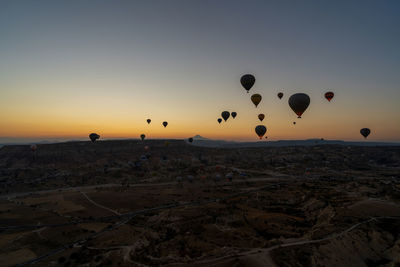 Cappadociawide angle aerial shot of colorful hot air balloons floating in the sky at morning sunrise