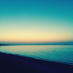 Scenic view of sea against clear sky during sunset