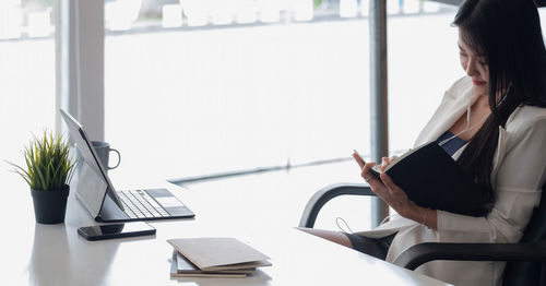 Woman working on table