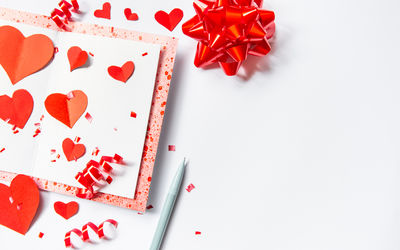 High angle view of heart shape on white table