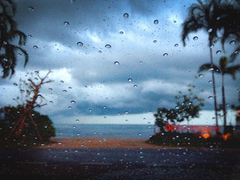 Raindrops on glass window of rainy season