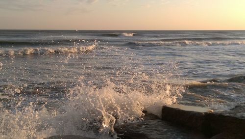 Scenic view of sea against sky at sunset