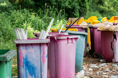 Plastic bins were left in the garbage collection area. pollute