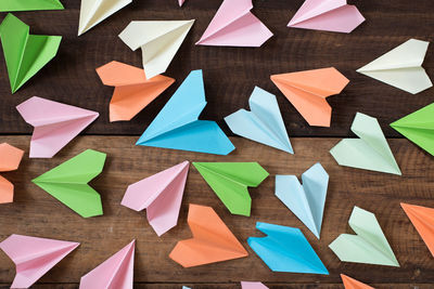 High angle view of multi colored paper on table