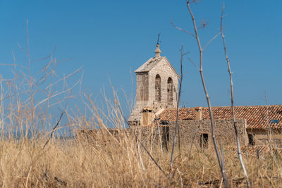 Low angle view of moya's church against clear sky