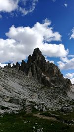 Scenic view of mountains against cloudy sky