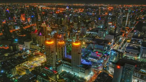 High angle view of illuminated city buildings at night