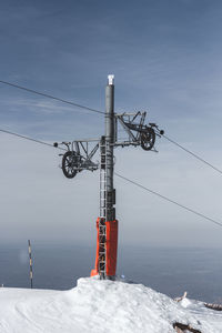 Crane against sky during winter