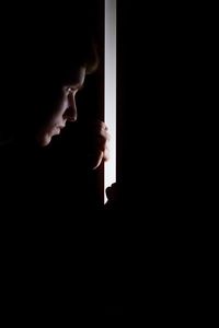 Portrait of woman looking at window