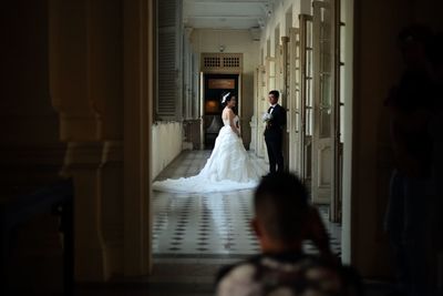 Woman standing in corridor