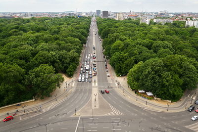 High angle view of road amidst trees in city