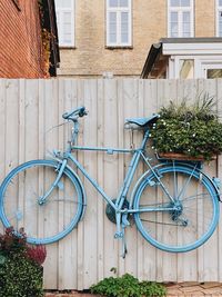 Bicycle against wall of building